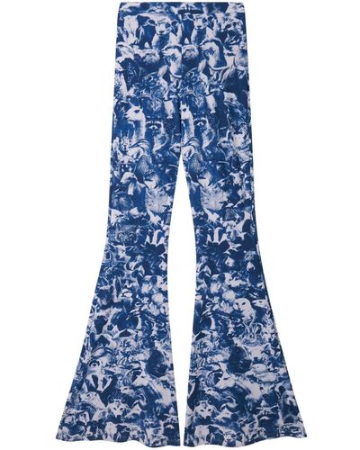 Stella McCartney Halbhohe Schlagjeans mit Animal Forest-Print - Blau