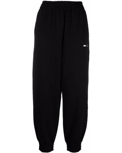 McQ Pantalon de jogging à logo imprimé - Noir