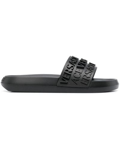 Versace Slides in gomma con logo in rilievo - Nero