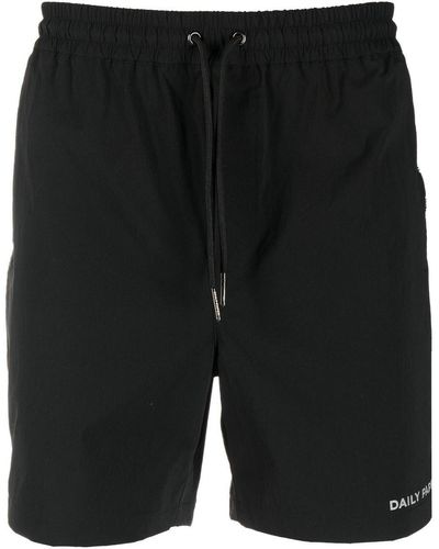Daily Paper Pantalones cortos con logo estampado - Negro
