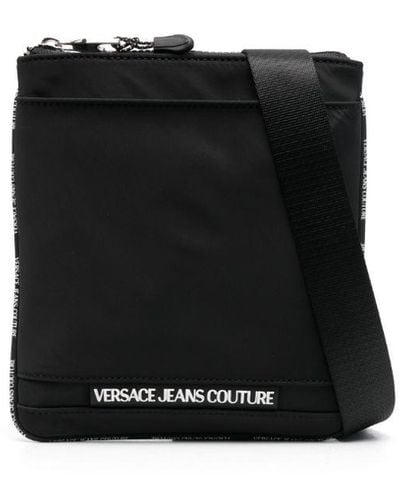 Versace Bolso messenger con logo en relieve - Negro