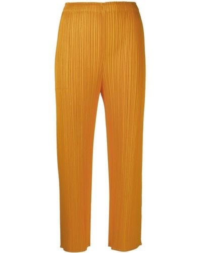 Pleats Please Issey Miyake Pantalon court à design plissé - Orange