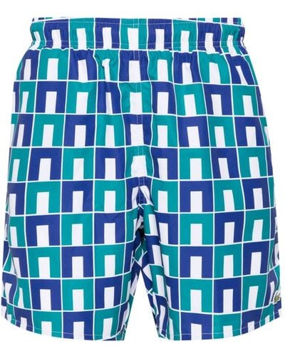 Lacoste Monogram-print Drawstring Swim Shorts - Blue