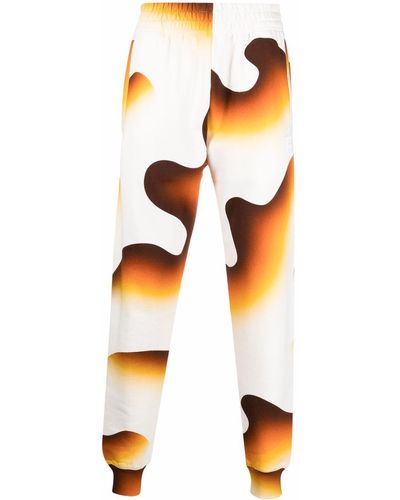 Etudes Studio Pantalones joggers con humo estampado - Multicolor