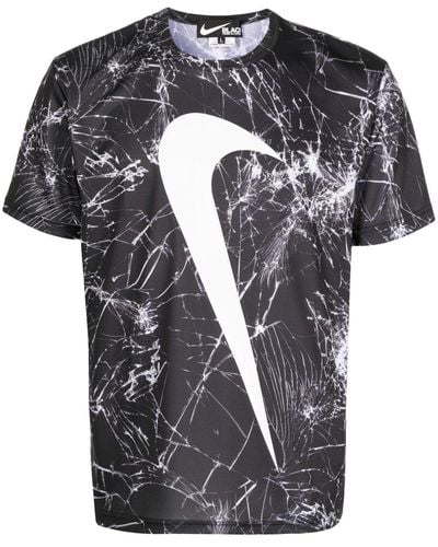 COMME DES GARÇON BLACK T-shirt à imprimé Swoosh - Noir