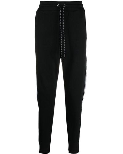 MICHAEL Michael Kors Pantalones de chándal con franjas del logo - Negro