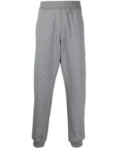 Versace Pantalon de jogging slim à logo imprimé - Gris