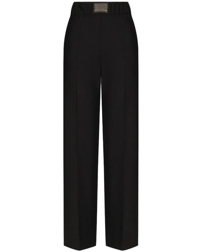 Dolce & Gabbana Pantalón acampanado de lana con placa con logotipo - Negro