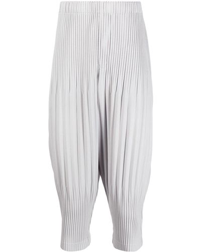 Homme Plissé Issey Miyake Pantalones ajustados de tiro caído - Blanco