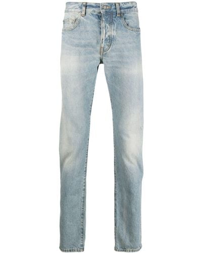 Saint Laurent Slim-Fit-Jeans mit Logo-Schild - Blau
