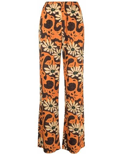 Nanushka Pantalones anchos con motivo floral - Naranja