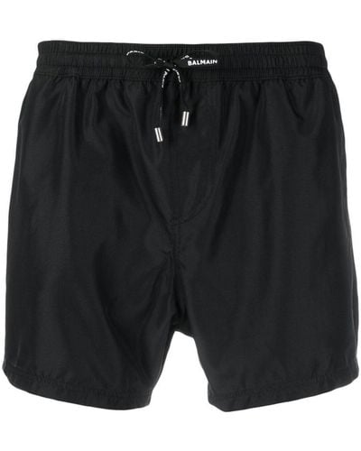 Balmain Pantalones cortos de chándal con franjas del logo - Negro