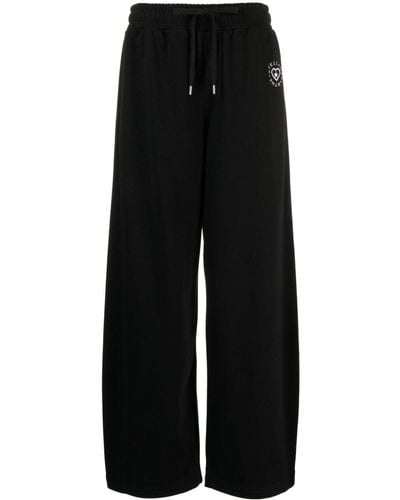 Stella McCartney Pantalon de jogging en coton à patch logo - Noir
