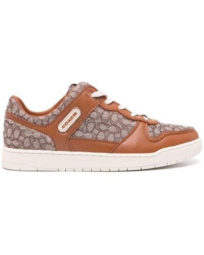 COACH Monogram-pattern lace-up sneakers - Marrone