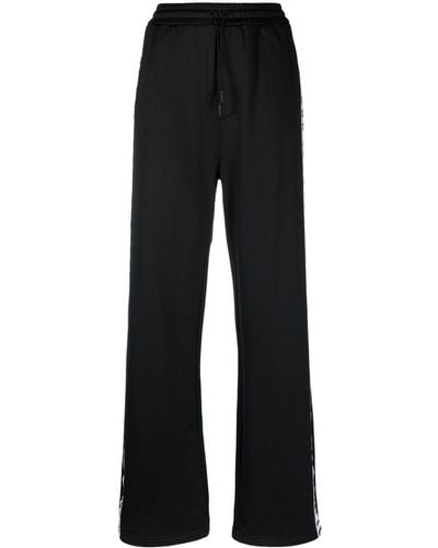 DSquared² Pantalones de chándal con franjas del logo - Negro