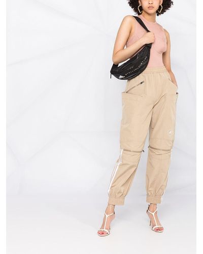 Stella McCartney Pantalones de chándal con franjas con logo - Neutro