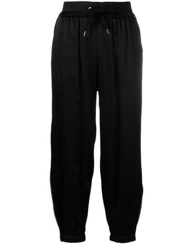Brunello Cucinelli Pantalones de chándal con rayas laterales - Negro