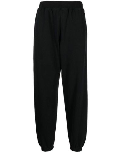 Aries Pantalon de jogging en coton à logo imprimé - Noir