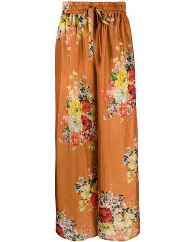 Zimmermann Pantaloni a vita alta con stampa floreale e gamba larga - Arancione