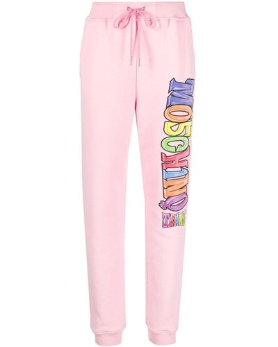 Moschino Jeans Pantalon de jogging en coton à logo imprimé - Rose