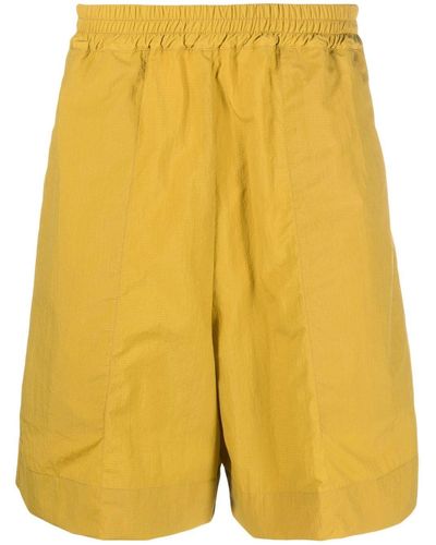 Studio Nicholson Pantalones cortos de chándal con cinturilla elástica - Amarillo