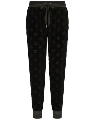 Dolce & Gabbana Pantalon de jogging à logo DG imprimé - Noir