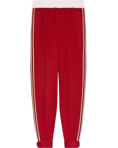Gucci Pantaloni sportivi con banda laterale - Rosso