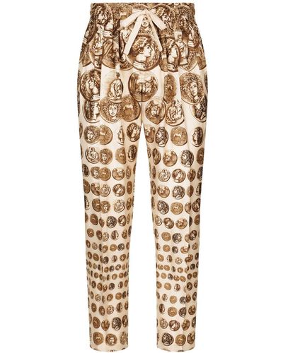 Dolce & Gabbana Pantalon en soie à imprimé graphique - Neutre