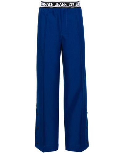 Versace Logo-waistband Pleated Wide-leg Trousers - Blue