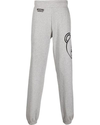 Moschino Pantalon de jogging à logo imprimé - Gris