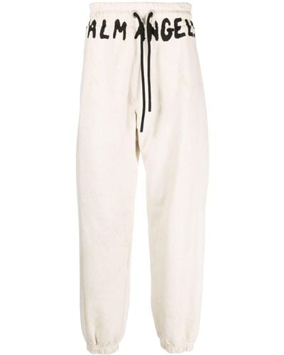 Palm Angels Pantalones de chándal con logo estampado - Blanco