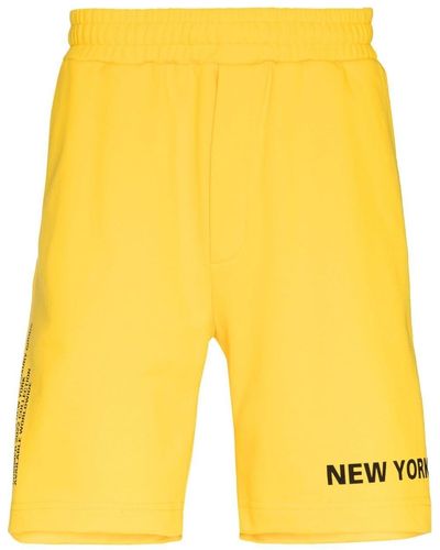 Helmut Lang Pantalones cortos con eslogan estampado - Amarillo