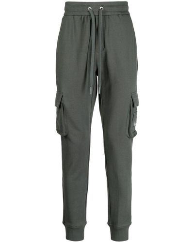 Moose Knuckles Pantalon de jogging en coton à poches cargo - Gris