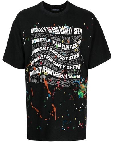 Mostly Heard Rarely Seen Warped-logo Paint-splatter T-shirt - Black