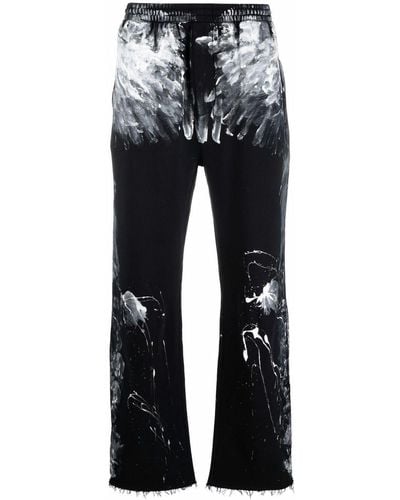 Balenciaga Pantalon de jogging à imprimé effet peinture - Noir