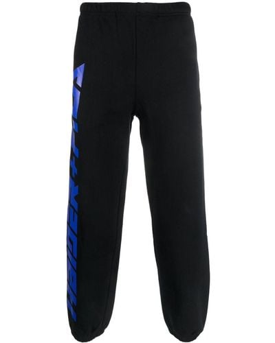 Haider Ackermann X Fila pantalon de jogging à logo imprimé - Bleu