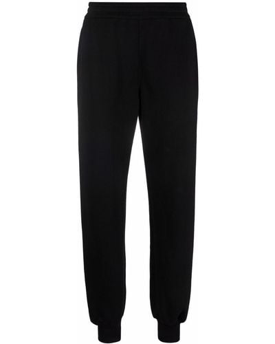 Alexander McQueen Pantalon de jogging à logo imprimé - Noir