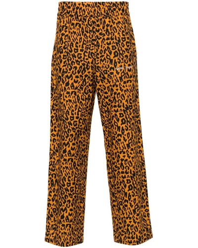 Palm Angels Pantalones de chándal con estampado de guepardo - Naranja