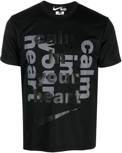 COMME DES GARÇON BLACK Slogan-print Swoosh T-shirt - Black
