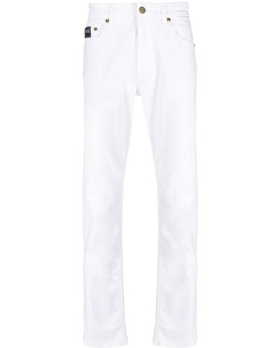 Versace Logo-patch Slim-cut Jeans - White