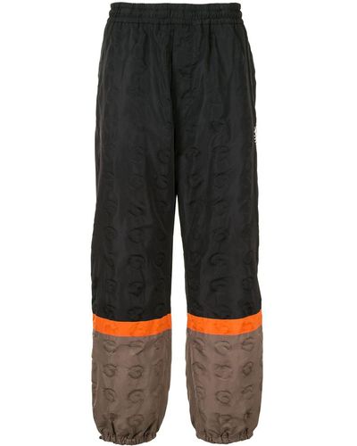 Undercover Pantalones de chándal con diseño colour block - Negro