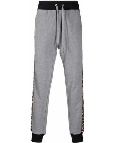 Dolce & Gabbana Pantalones joggers con estampado de leopardo - Gris
