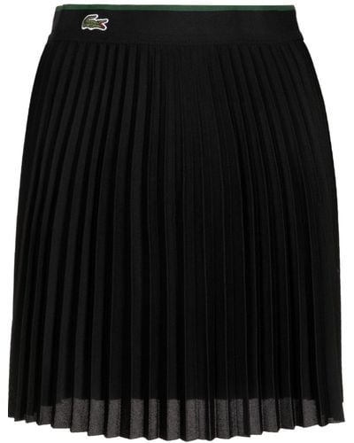 Lacoste Minifalda plisada con parche del logo - Negro