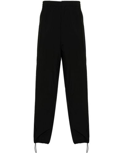 Prada Pantalon ample à design imperméable - Noir