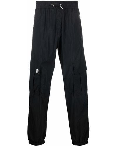 Balmain Pantalon de jogging à patch logo - Noir