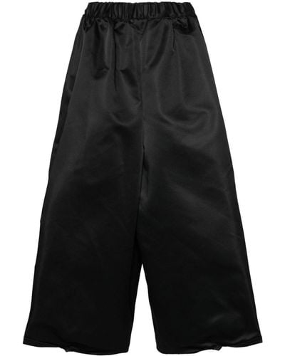 Comme des Garçons Pantalones anchos estilo capri - Negro