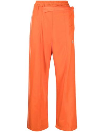 Y-3 Pantalones Firebird anchos de x adidas - Naranja