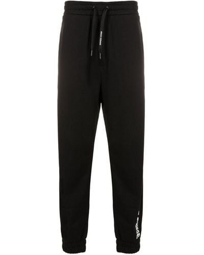 Armani Exchange Pantalones de chándal con logo estampado - Negro