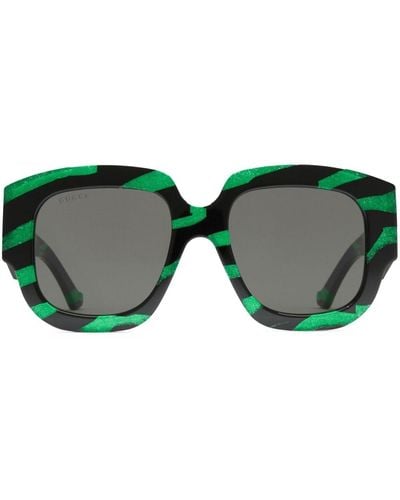 Gucci Gestreifte Sonnenbrille mit eckigem Gestell - Grün