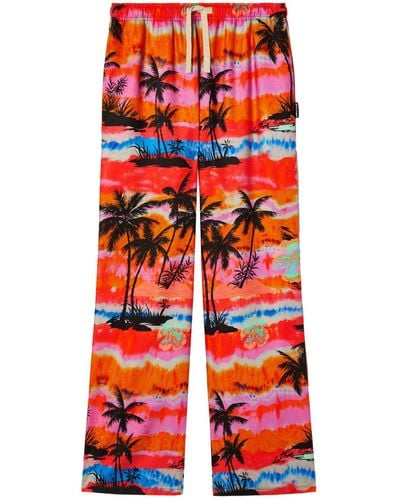 Palm Angels Pantalon ample à imprimé palmiers - Rouge